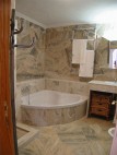 Bathroom with separate bath and shower tub 